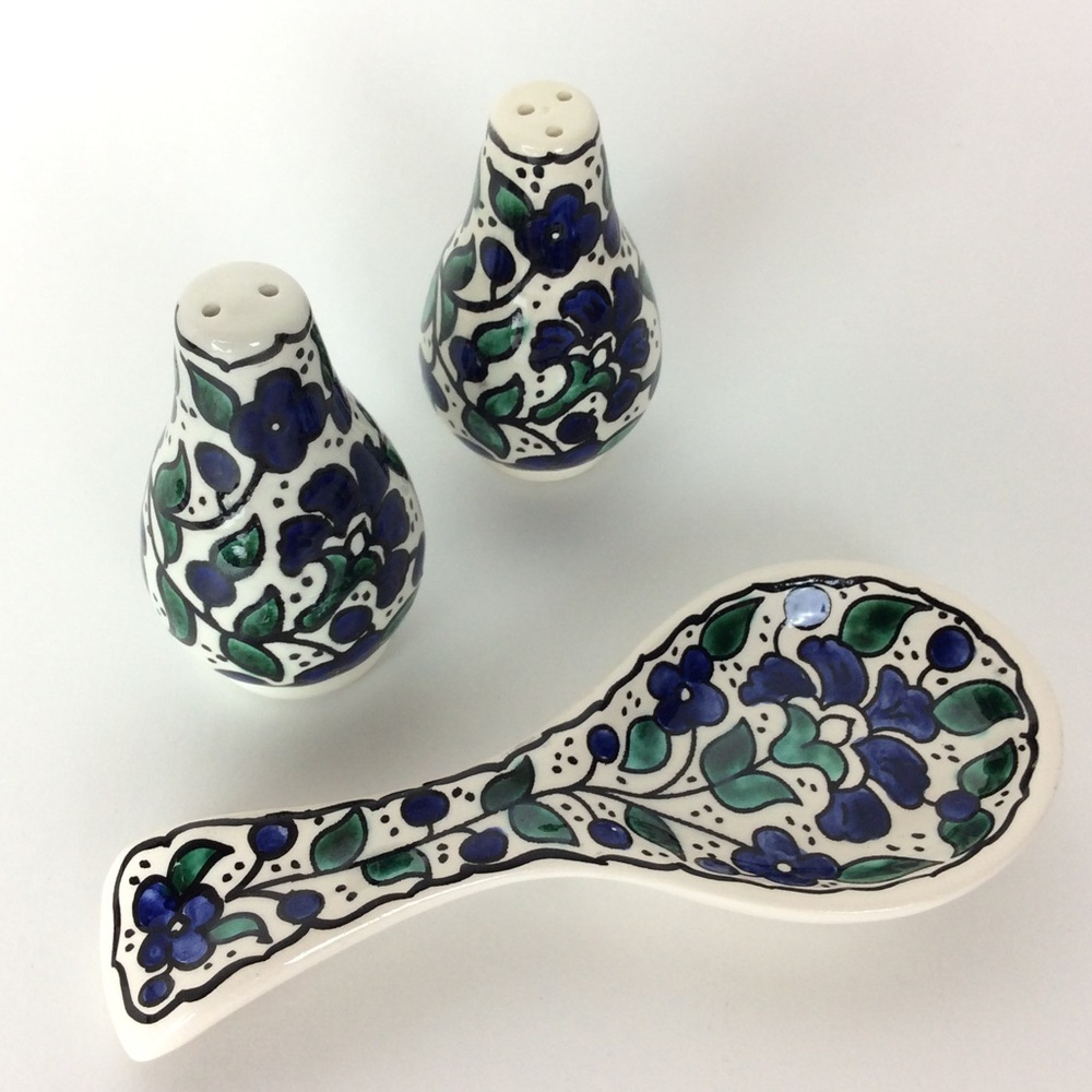 Salt and pepper shakers with spoon holder.